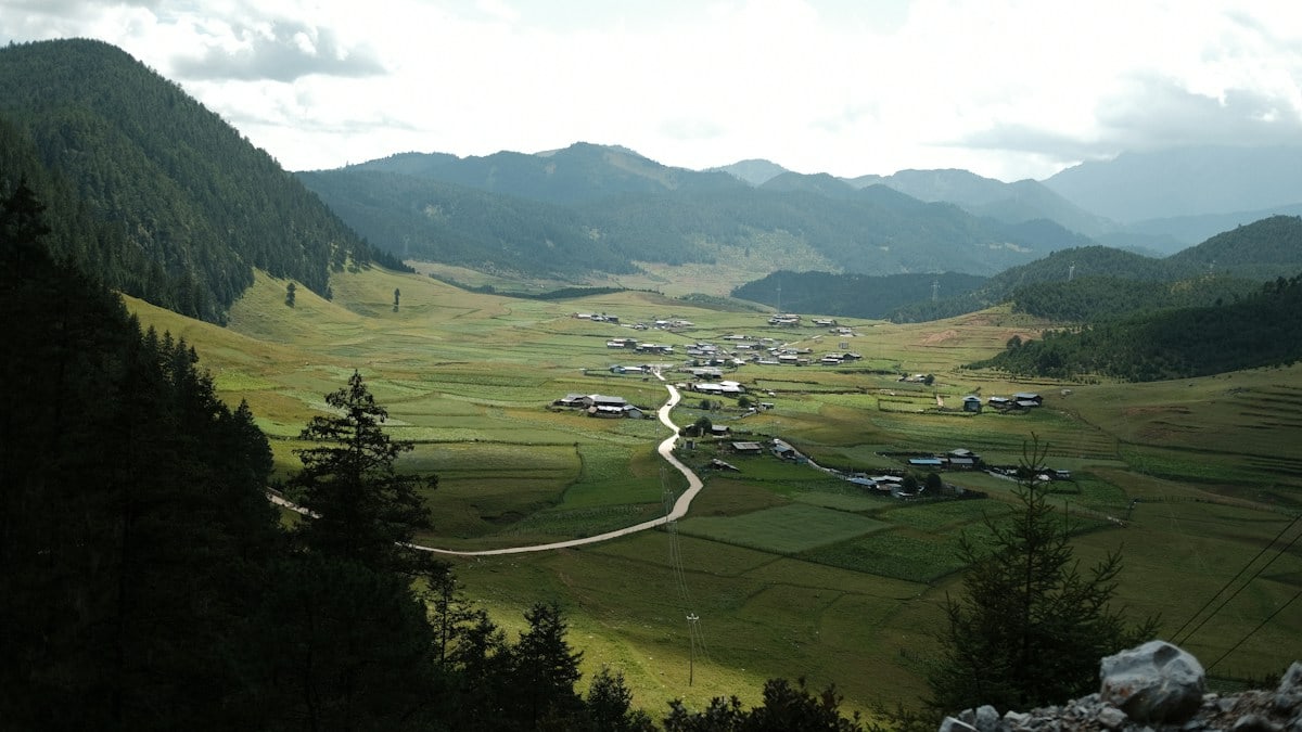 A small village nestled in a green mountain valley